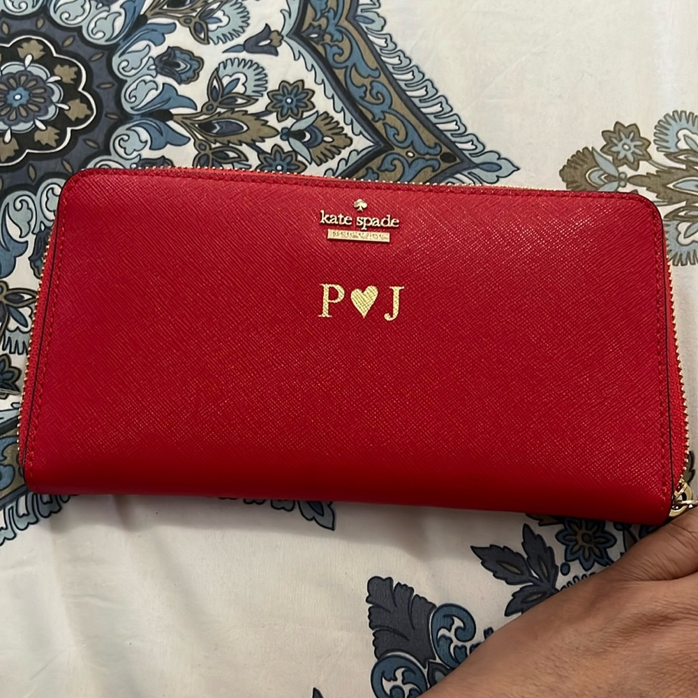 Kate Spade red long zip around wallet.